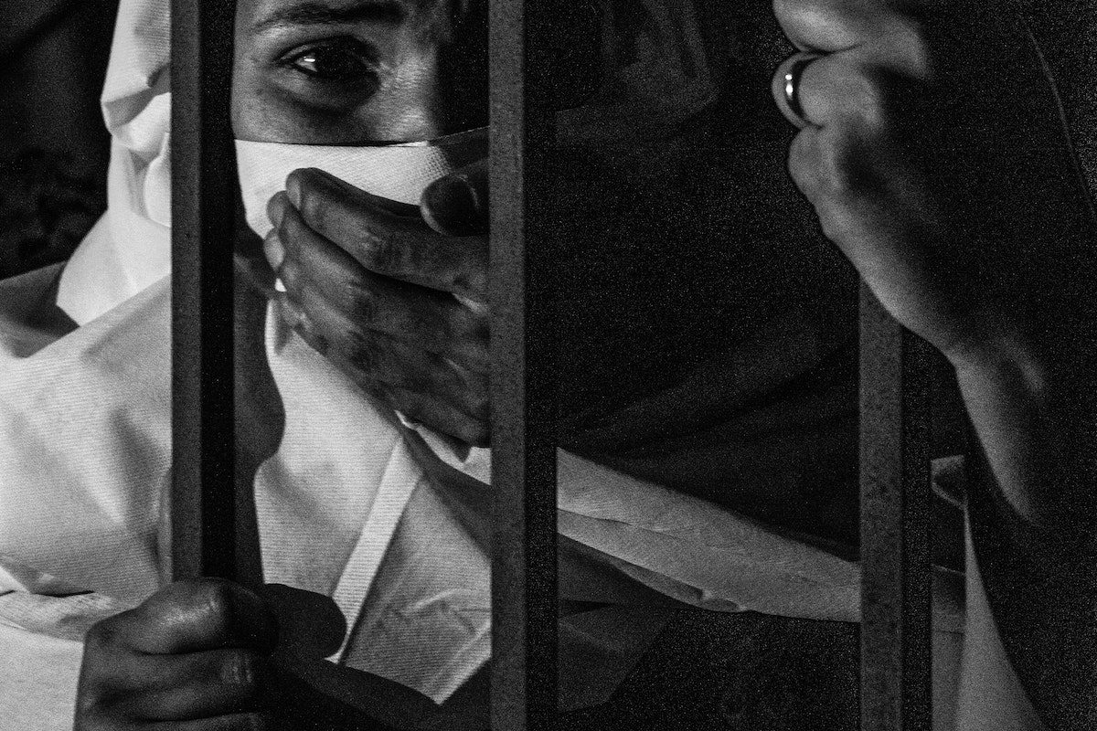 Grayscale Photography of Woman Inside Jail