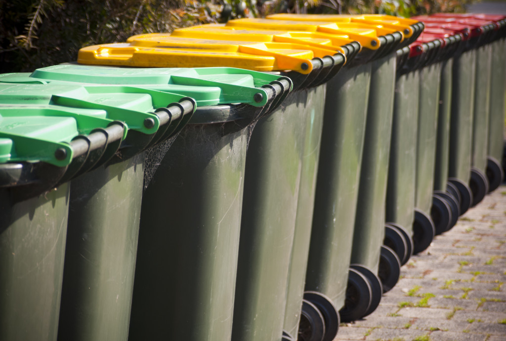 different colored rolling bins for waste management in a consruction site
